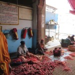 Men peeling and chopping carrots at the Gurudwara Bangla Sahib, Delhi