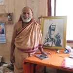 The Shankaracharya of Karvir Peeth, in the front office with a picture of Swami Rama
